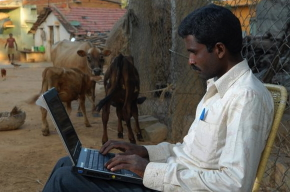 Poor Indian with laptop.